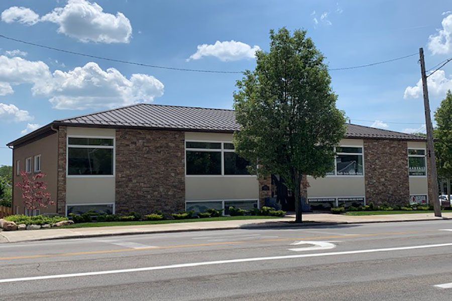 About Our Agency - Closeup View of the Andrako Insurance Consultants Office Building Against a Cloudy Blue Sky in Fairview Park Ohio